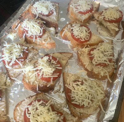 Preparing the bruschetta toast.