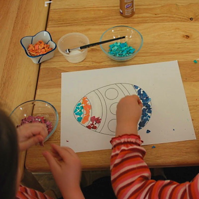 Glue colored eggshell pieces onto paper design to make a mosaic.