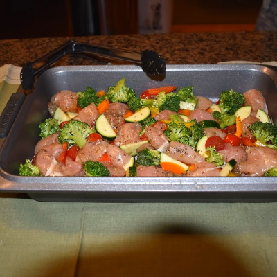 Roasted Veggies and Chicken in pan.