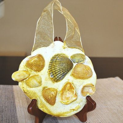 Make this seashell hanging for Aloha Week.