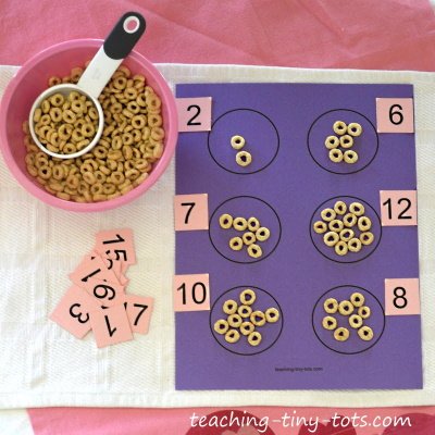 Learning to count with our free Cheerio Counting page.