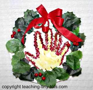 Make this cute handprint in wreath gift for Christmas.