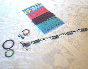 Materials to make a bead key chain.