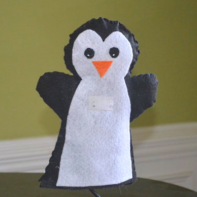 Penguin puppet made out of felt.