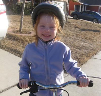 3-year-old Marlee on her balance bike.