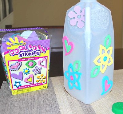 Make a watering jug using a milk jug.