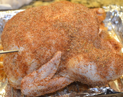 Season the chicken liberally with your favorite rub.
