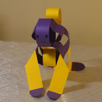 Chinese zodiac monkey made of colored construction paper strips.