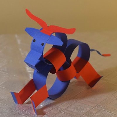 Chinese zodiac ox made of colored construction paper strips.