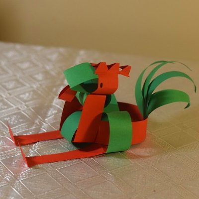 Chinese zodiac rooster made of colored construction paper strips.
