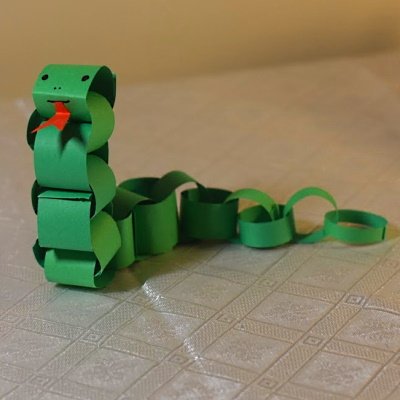 Chinese zodiac snake made of colored construction paper strips.