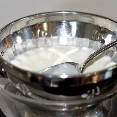 straining yogurt to make it thicker