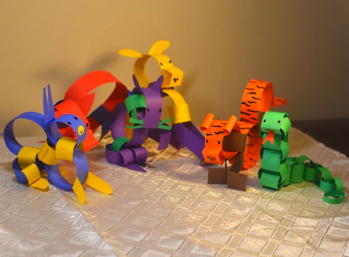 Chinese zodiac animals made with construction paper strips.