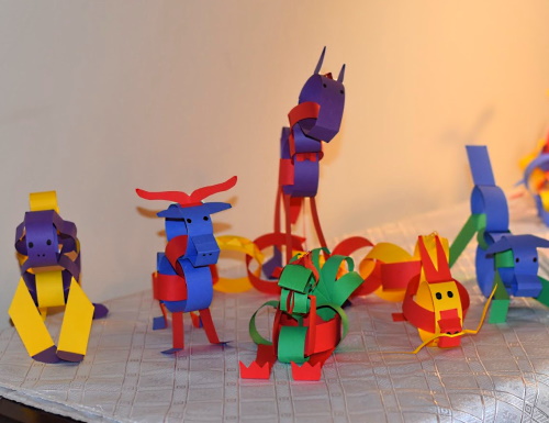 Chinese zodiac animals made with construction paper strips.