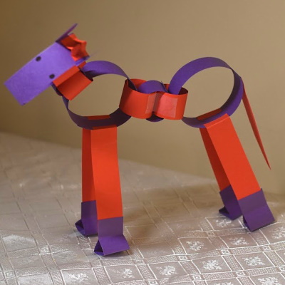 Chinese zodiac horse made of colored construction paper strips.